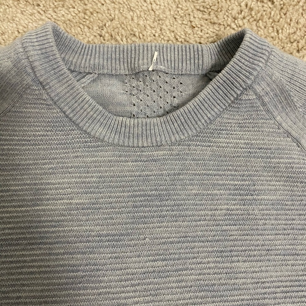 Pretty grey/blue sweater.  Fitted.